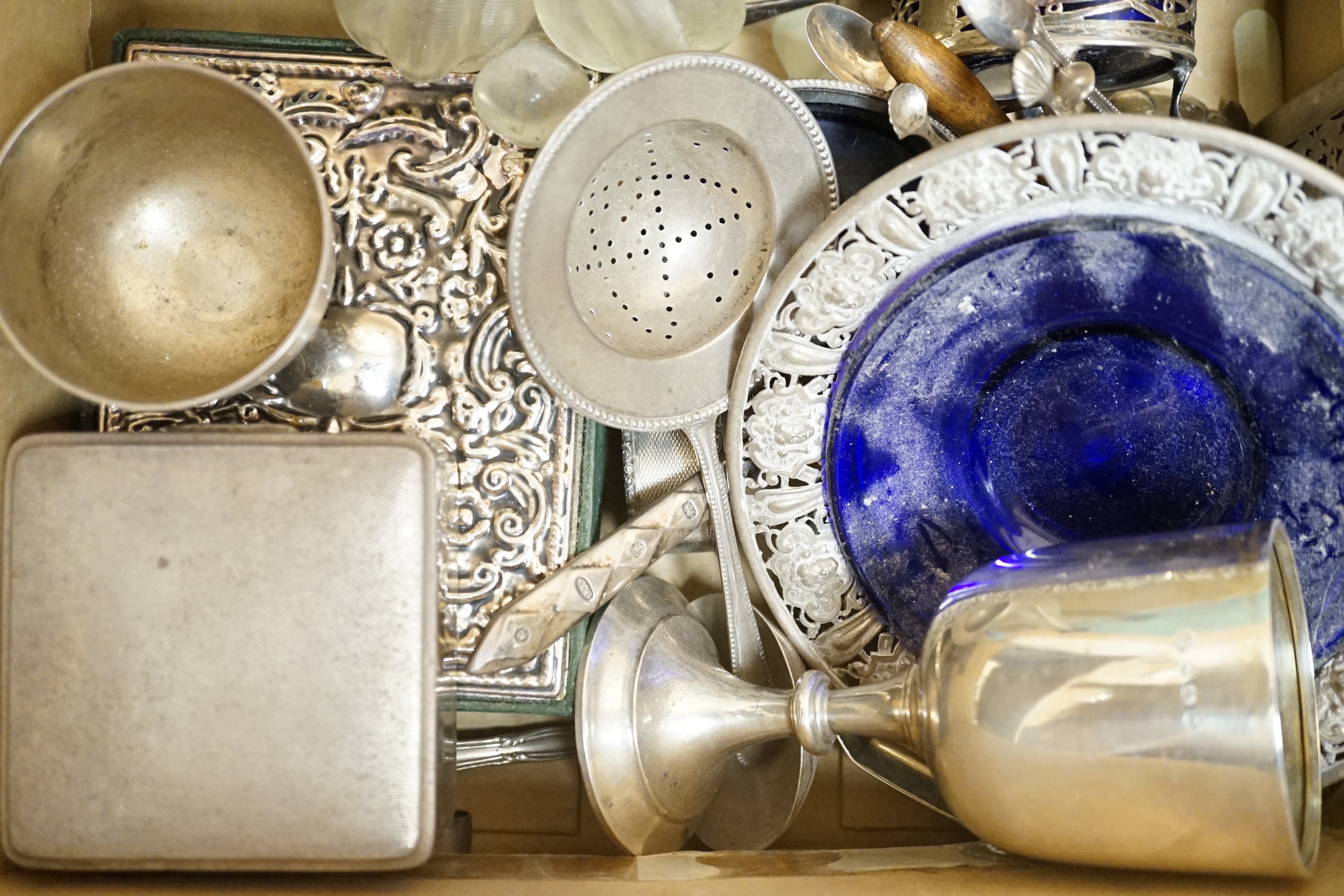 Sundry silver including a boxed set of eight Cartier sterling condiments 37mm, cigarette box, goblet, dish with blue glass liner, bowl, tumbler cup, flatware, mounted glass oil and vinegar bottle, etc.